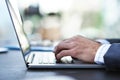 Businessman, hands and typing with laptop for email, communication or research on office desk. Closeup of man, employee Royalty Free Stock Photo