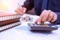 Businessman hands using calculator and Financial data analyzing at the office Royalty Free Stock Photo