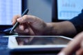 Businessman hands using digital tablet computer in hight office Royalty Free Stock Photo