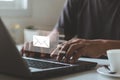 Businessman hands using Laptop typing on keyboard and surfing the internet on office table with email icon Royalty Free Stock Photo