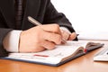 Businessman hands writing in organizer