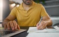 Businessman, hands and writing with pen by laptop for accounting, finance or planning schedule at home. Hand of male Royalty Free Stock Photo