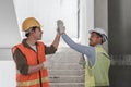 Businessman handshake with engineering in construction renovate building site. Engineer or architect inspection Royalty Free Stock Photo