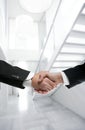 Businessman handshake on modern white office Royalty Free Stock Photo