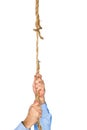 Businessman hanging from frayed rope Royalty Free Stock Photo