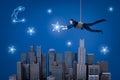 A businessman hanging on a rope above a night city and trying to catch a star in the sky.