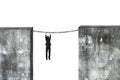 Businessman hanging rusty chain connected concrete walls