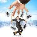 Businessman hanging on strings like marionette Royalty Free Stock Photo