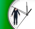 Businessman hangs on an arrow of clock Royalty Free Stock Photo