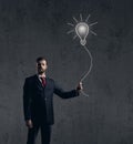 Businessman has an idea. Dark and dramatic background. Business, solution, concept. Royalty Free Stock Photo