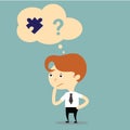 Businessman has a problem to answer and connect puzzle pieces. Royalty Free Stock Photo