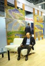 Businessman having break at the table at the negotiating room during an exhibition. Solar Energy Trade Show. Kiev Royalty Free Stock Photo