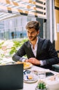 Businessman having breakfast and doing his work in cafe Royalty Free Stock Photo