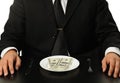 The businessman having dinner dollars Royalty Free Stock Photo