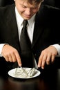 The businessman having dinner dollars Royalty Free Stock Photo