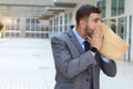 Businessman having a panic attack Royalty Free Stock Photo