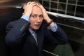 Businessman having panic attack in elevator Royalty Free Stock Photo