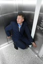 Businessman having panic attack in elevator Royalty Free Stock Photo