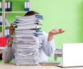 Businessman having problems with paperwork and workload Royalty Free Stock Photo