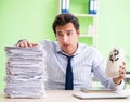 Businessman having problems with paperwork and workload Royalty Free Stock Photo