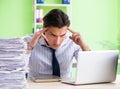 Businessman having problems with paperwork and workload Royalty Free Stock Photo