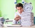 Businessman having problems with paperwork and workload Royalty Free Stock Photo