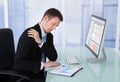 Businessman Having Shoulder Pain At Computer Desk