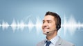 Businessman in headset over sound wave or diagram
