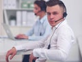 Businessman with headset smiling at camera in call center Royalty Free Stock Photo