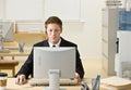 Businessman in headset working at computer Royalty Free Stock Photo