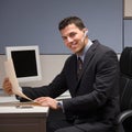 Businessman with headset working at desk Royalty Free Stock Photo