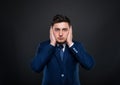 Businessman in the hear no evil pose Royalty Free Stock Photo