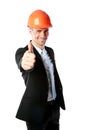 Businessman in helmet giving thumbs up