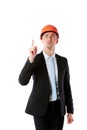 Businessman in helmet pointing up at copyspace Royalty Free Stock Photo