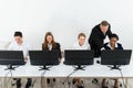 Businessman Helping His Colleagues In The Office Royalty Free Stock Photo