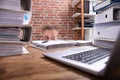Businessman Hiding Behind The Desk Royalty Free Stock Photo