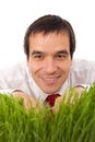 Businessman hiding in grass - isolated Royalty Free Stock Photo