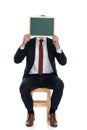 Businessman hiding his face behind a board Royalty Free Stock Photo