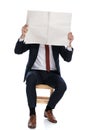 Businessman hiding his face behind a newspaper Royalty Free Stock Photo