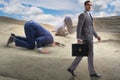 The businessman hiding his head in sand escaping from problems Royalty Free Stock Photo