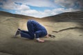 The businessman hiding his head in sand escaping from problems Royalty Free Stock Photo