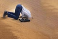 The businessman hiding his head in sand escaping from problems Royalty Free Stock Photo