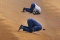 The businessman hiding his head in sand escaping from problems Royalty Free Stock Photo