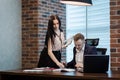 Businessman and his assistant Secretary in his office. The Secretary brought the boss documents to sign,Boss signs the documents Royalty Free Stock Photo