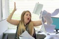 Businessman at his desk throws documents and papers into the air Royalty Free Stock Photo