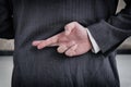 Businessman with his fingers crossed behind his back.Dishonest relationship and betrayal concept Royalty Free Stock Photo