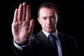 Businessman with his hand raised in signal to stop Royalty Free Stock Photo