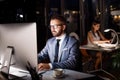 Businessman in his office at night working late. Royalty Free Stock Photo