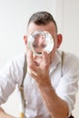 Businessman in his 50s looks at a crystal ball Royalty Free Stock Photo