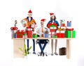 Businessman and his team next to desk with lots of presents and Christmas gifts. Royalty Free Stock Photo